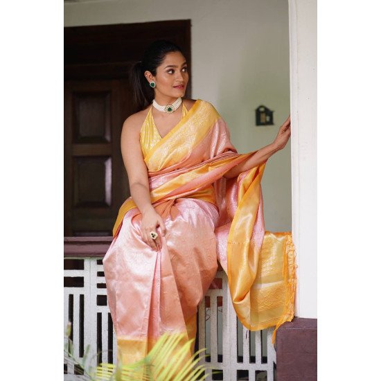 Mesmerizing Peach banarasi silver zari saree with contrast yellow blouse